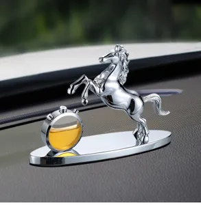 Chrome horse car perfume ornament detail shot, metallic texture interior decoration piece.