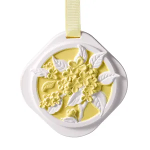 Hanging gypsum aromatherapy pendant with yellow floral relief for wardrobe, bedroom and car decor.