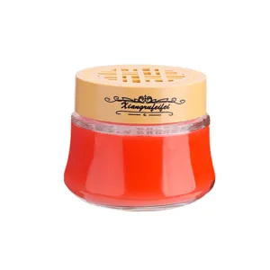 Solid car air freshener long lasting fragrance gel in glass jar with yellow lid for auto odor removal.