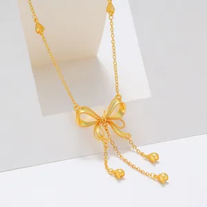 Elegant 24k gold plated tassel bow necklace, stylish copper alloy clavicle chain for women.