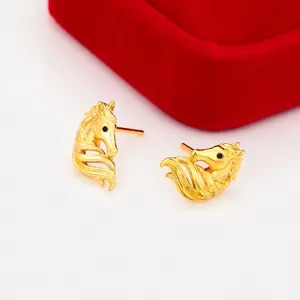 Detailed view of gold horse head stud earrings featuring polished finish and fine mane styling.