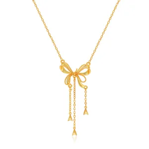 Gold bow tassel necklace detail close-up, elegant copper alloy clavicle chain jewelry for women.