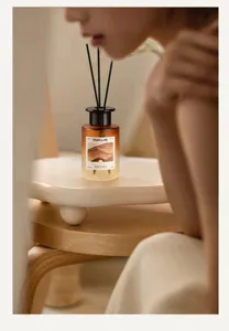 Modern home fragrance diffuser bottle with essential oil and black reeds for bedroom decor