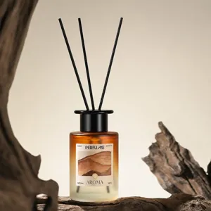 Aromatherapy reed diffuser bottle with black sticks, home fragrance essential oil decor.