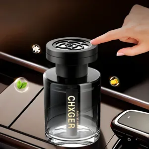 Car perfume diffuser bottle with rose cap, elegant black glass design for vehicle interior freshness.