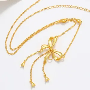 Gold plated bow tassel necklace for women, elegant clavicle chain fashion jewelry accessory.