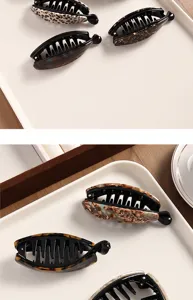 Acetate banana hair clip detail, elegant vertical claw clip for stylish ponytails and buns.