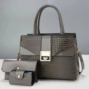 Grijs krokodillenpatroon handtas set met stijlvol metalen slot en elegante strakke vorm.
