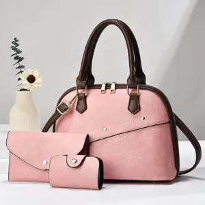 Vista detallada del elegante juego de bolsos rosa y marrón con su billetera coordinada.