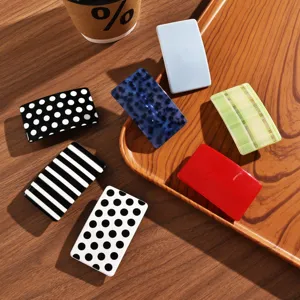 Acetate hair clips set with dopamine polka dot and stripe patterns for chic hairstyles.