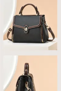 Vue détaillée du sac à épaule élégant pour femme en noir et brun avec serrure en métal.