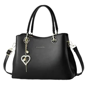 Fashion black women handbag large capacity shoulder crossbody tote bag with heart pendant.