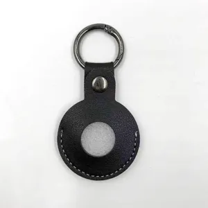 Black leather protective case detail view, circular tracker holder with metal keychain ring.