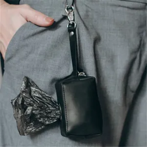 Black leather dog waste bag dispenser holder with metal clasp for pets walking and outdoor.