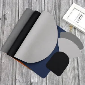 Detail view of Nordic style leather placemats set, waterproof and heat-insulating table mats.