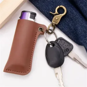 Vintage brown leather lighter protective case with metal keychain ring. Durable portable cover.