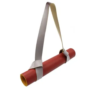 Portable leather yoga mat strap and carrier red rolled mat detail view for fitness training
