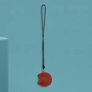 Leather mini pouch detail view for earphones and small items hanging cord style