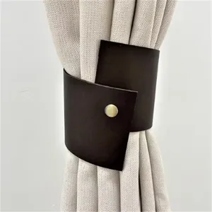 Nordic style PU leather curtain tieback detail shot, elegant brown finish with metal snap.