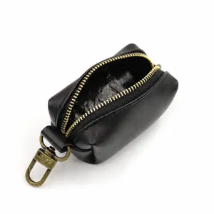 Black leather dog waste bag holder with metal clasp and zipper for pet walking daily use.