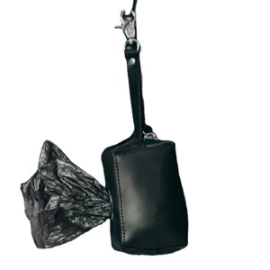 Black leather dog waste bag holder with metal clip, portable pet poop bag dispenser pouch.