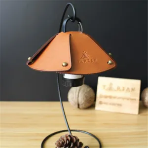 Leather camping lampshade with metal stand for outdoor rechargeable mini lights and lanterns.