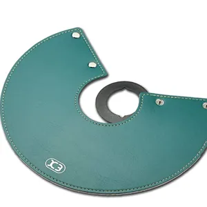 Detail view of teal leather camping lantern shade, showing precise stitching and metal snaps.