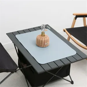 Outdoor leather camping mat detail view, showing smooth texture and waterproof surface for picnic.