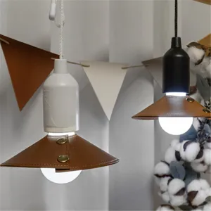 Outdoor detachable leather lampshade detail, retro camping hanging light cover with snap buttons.