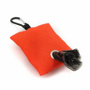 Closeup detail view of portable canvas dog poop bag dispenser with metal carabiner hook.