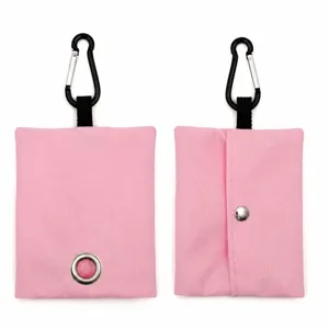 Pink canvas dog poop bag dispenser with carabiner, portable pet waste bag holder for outdoor walking.