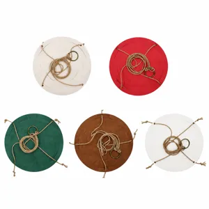 Hanging leather plant pot holder with rope and metal ring, outdoor decorative tray for green plants.