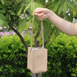 Portable leather milk tea cup sleeve square water bottle tote bag for outdoor daily use.