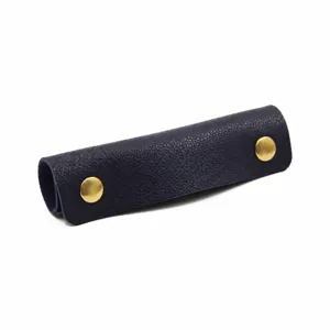 Dark blue leather luggage handle wrap with gold snap buttons, comfortable grip protector.