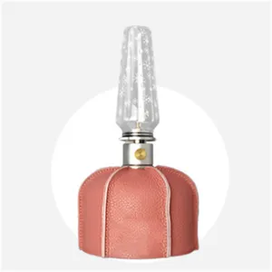 Outdoor camping flat gas tank leather protective cover with glass lantern shade accessory.