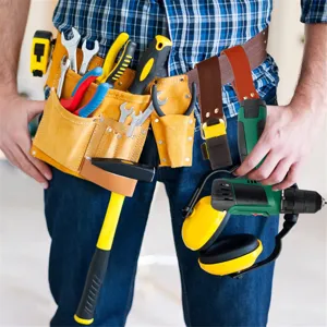 Heavy duty leather tool belt with multiple pockets and holders for electrician and builders.