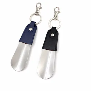 Portable metal shoehorn keychain with leather wrap, mini short shoe helper tool for travel.