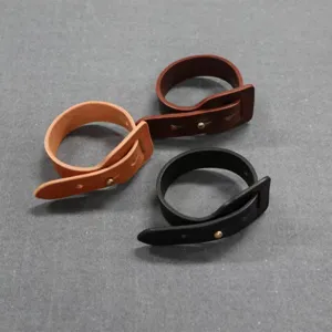 PU leather curtain tiebacks with metal snap button, durable drape holders for home decor.