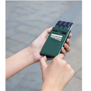 Porte-cartes pop-up en aluminium vert foncé au design élégant avec poche pour billets.