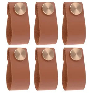 Brown leather cabinet pulls with gold screws, durable drawer handles for furniture decor.