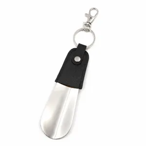 Portable metal shoehorn keychain with leather sleeve short shoe helper for daily use.