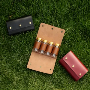 Leather camping spice bottle storage bag set with portable glass bottles for outdoor cooking.
