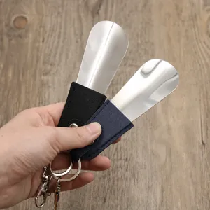 Portable metal shoehorn keychain with leather sleeve, short travel shoe helper for daily use.