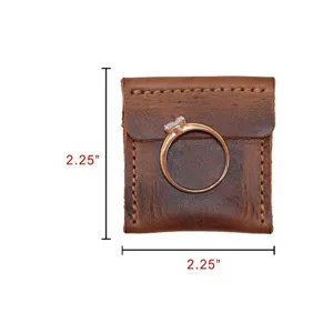 Detailed view of the square retro cowhide ring pouch showing compact leather storage size.