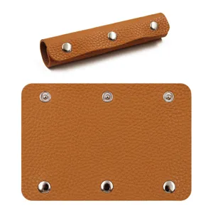 Brown PU leather luggage handle wrap cover with metal snap buttons for travel bags.
