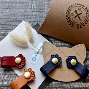 Cute cat paw leather cord organizer with snap button, multi-color headphone cable winder.