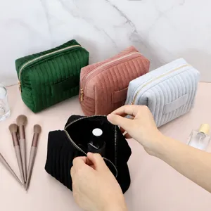 Velvet cosmetic bag with quilted design, portable makeup pouch and toiletry storage bag.