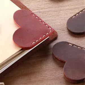Vintage crazy horse leather heart bookmark detail, handmade cowhide page marker for books.