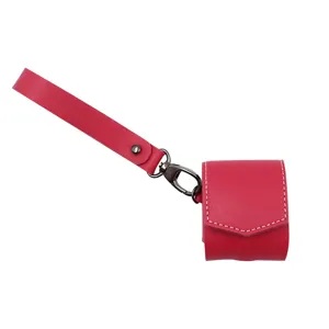Red PU leather wireless earphone case detail, featuring a convenient hand strap and metal clip.