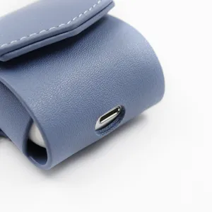 Blue PU leather wireless earphone protective case with charging port cutout and stitching.